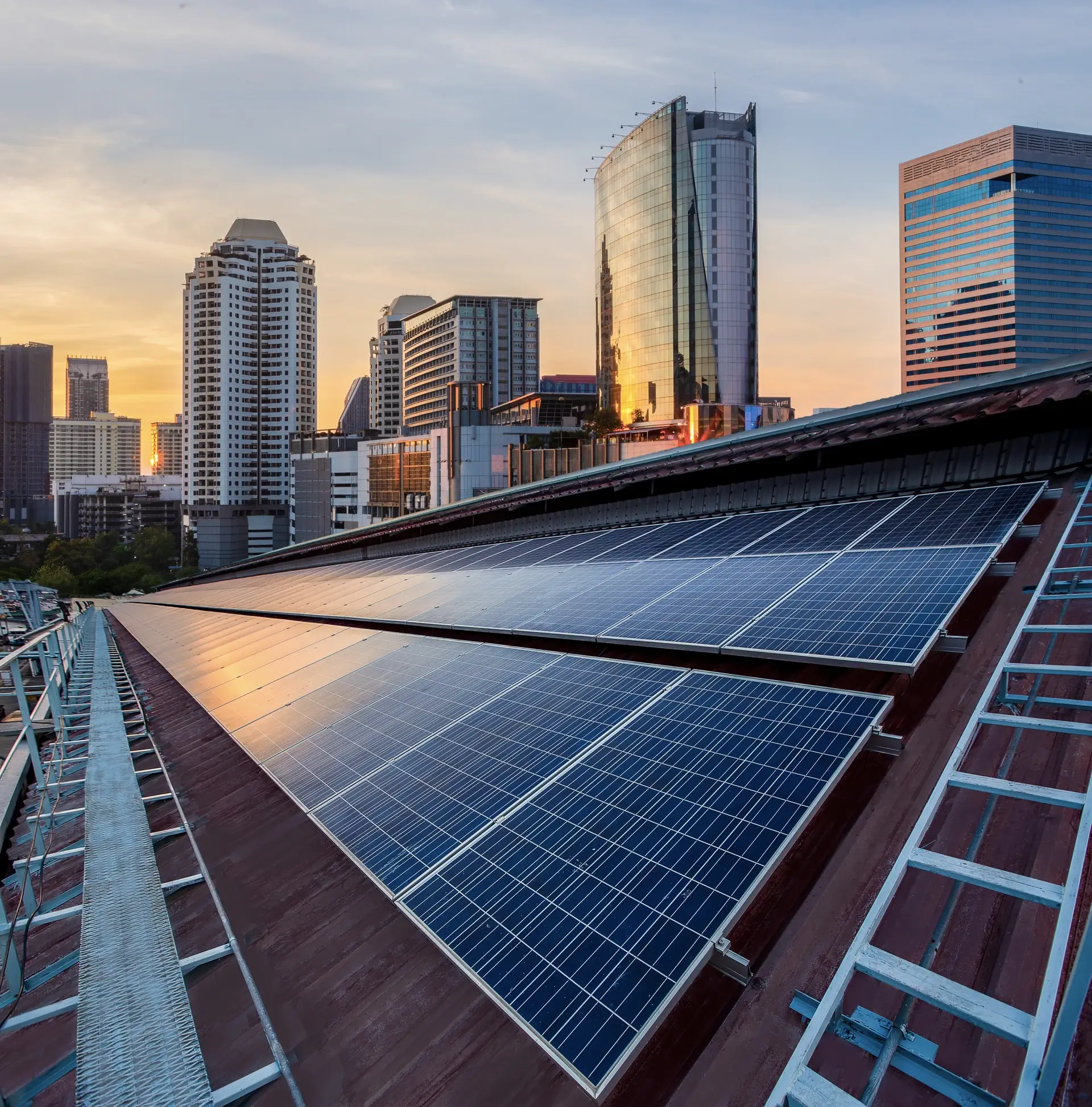 Buildings with solar panel installation at sunset